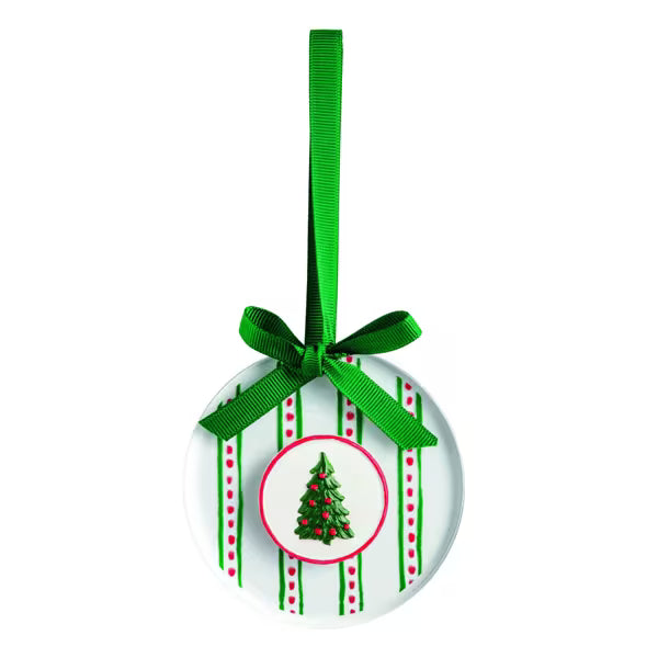 A round white Christmas ornament with green and red vertical stripes, a small green Christmas tree illustration in the center, and a bright green ribbon loop at the top.