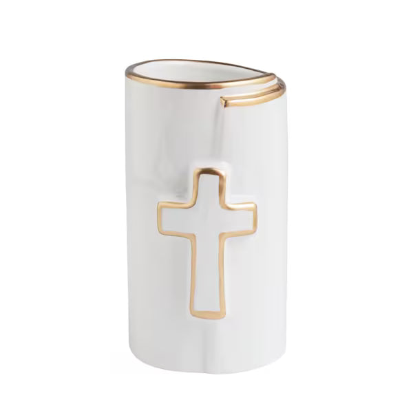 A white ceramic candle holder with a gold outline cross on the front and a gold rim at the top, shown on a plain white background.