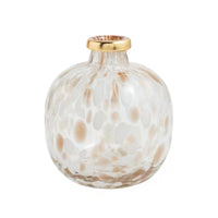 A small round glass vase with a textured, bubbly pattern in white and warm beige, featuring a metallic gold rim at the neck, set against a plain white background.