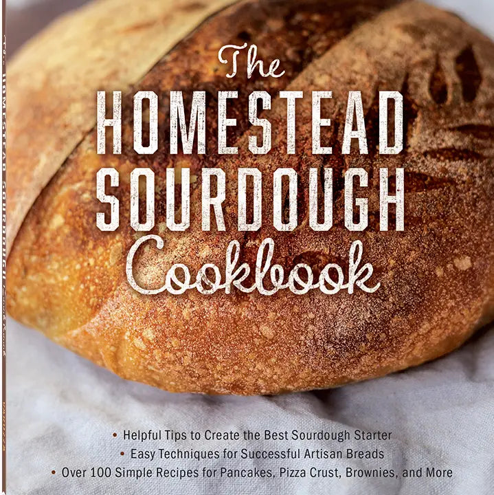Book titled 'The Homestead Sourdough Cookbook' with a loaf of bread on the cover.