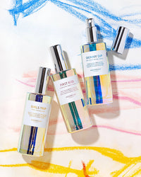 Skincare bottles with colorful labels on a abstract background