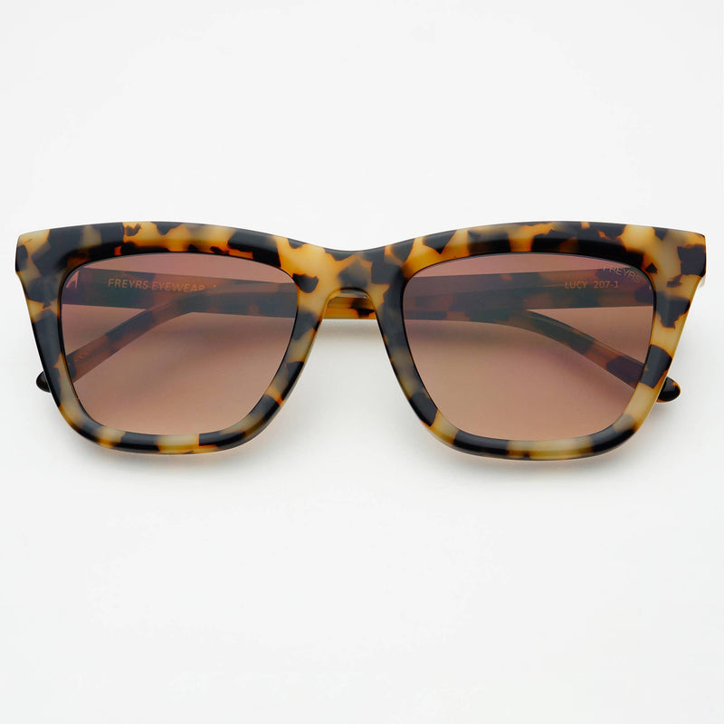 Tortoiseshell sunglasses with brown lenses on a white background