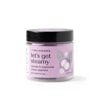 Jar of 'let's get steamy' lavender and chamomile shower steamers on a white background