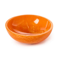 Orange ceramic bowl on a white background