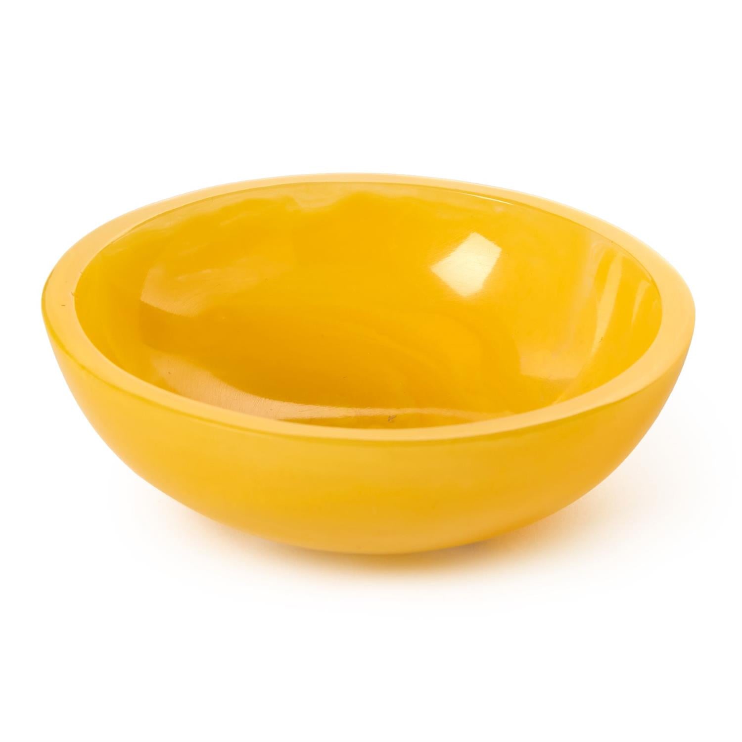 Yellow ceramic bowl on a white background