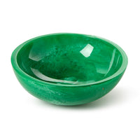 Green ceramic bowl on a white background