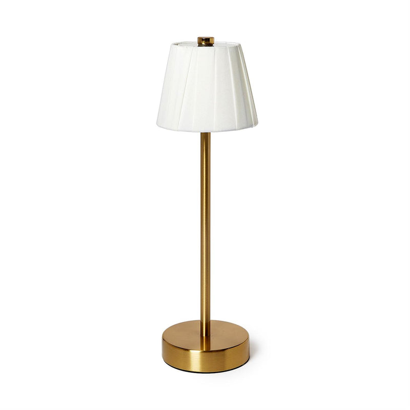 Gold floor lamp with a white shade on a white background