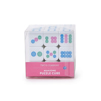 Mahjong puzzle cube in packaging with colorful patterns on a white background