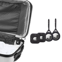 Open suitcase with black travel tags and keychains on a white background