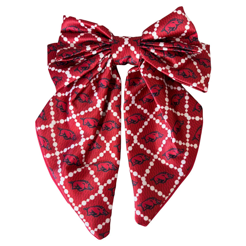 Red bow-shaped scarf with a pattern on a white background