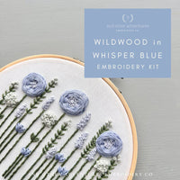 Embroidery kit with floral design and 'and other adventures embroidery co' branding.