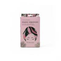 Mane Squeeze reversible satin hair towel packaging with tropical leaf design on a white background