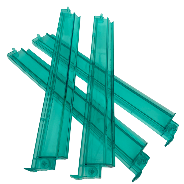 Set of green plastic strips on a white background