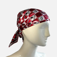 Red and black patterned headscarf on a mannequin head against a white background