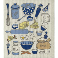 Embroidered kitchen-themed towel with various cooking utensils and ingredients.