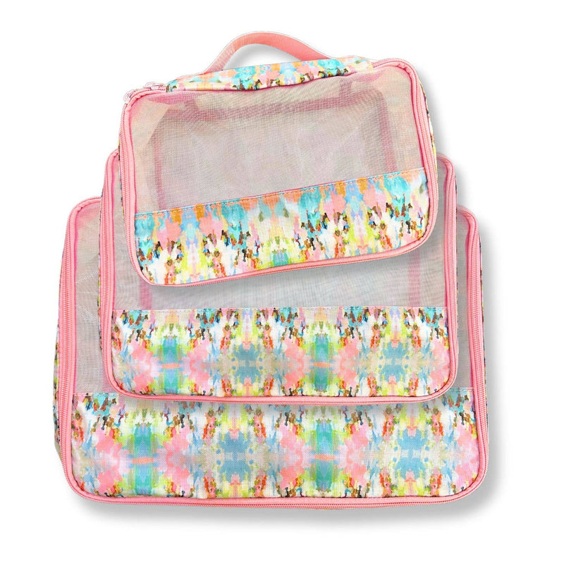 Set of 3  different sized packing cubes with colorful floral pattern on a white background