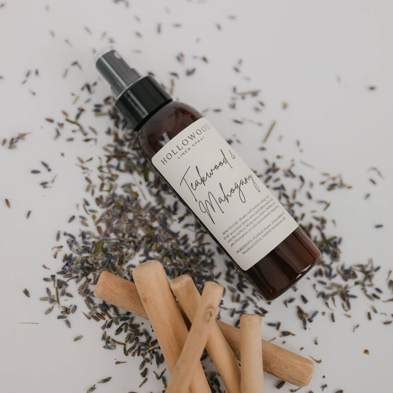 Bottle of Hollowood London Tea with lavender and cinnamon sticks on a white background