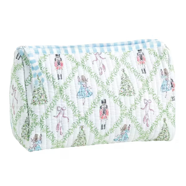 A quilted cosmetic pouch featuring a festive Christmas pattern with nutcrackers, ballerinas, Christmas trees, and bows, set against a white background with a light blue and white gingham trim.