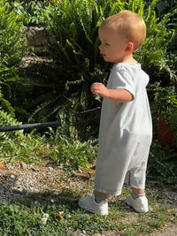 Child wearing Blue Stripe Short Sleeved Outfit
