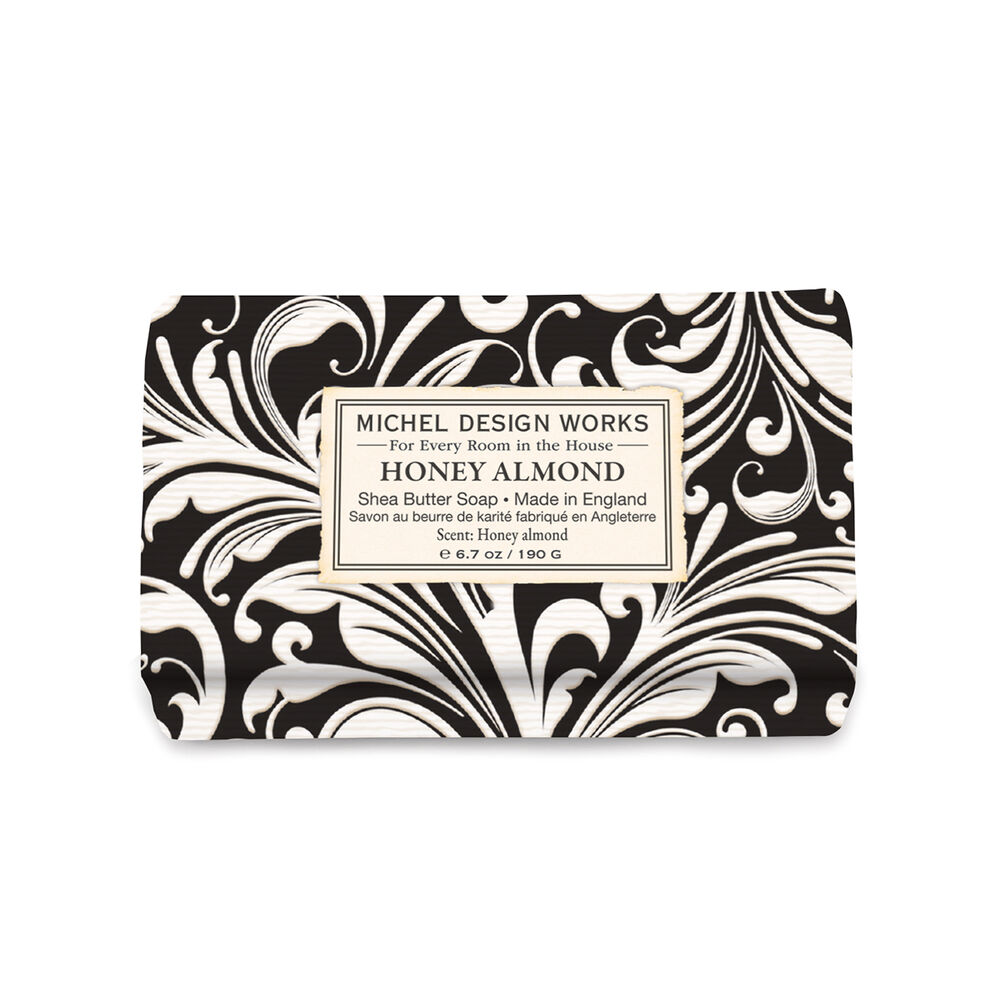 Bar of soap with black and white pattern and 'Michel Design Works' label on a white background