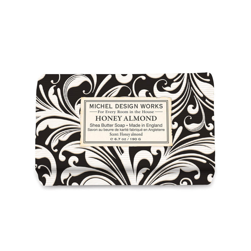 Bar of soap with black and white pattern and 'Michel Design Works' label on a white background
