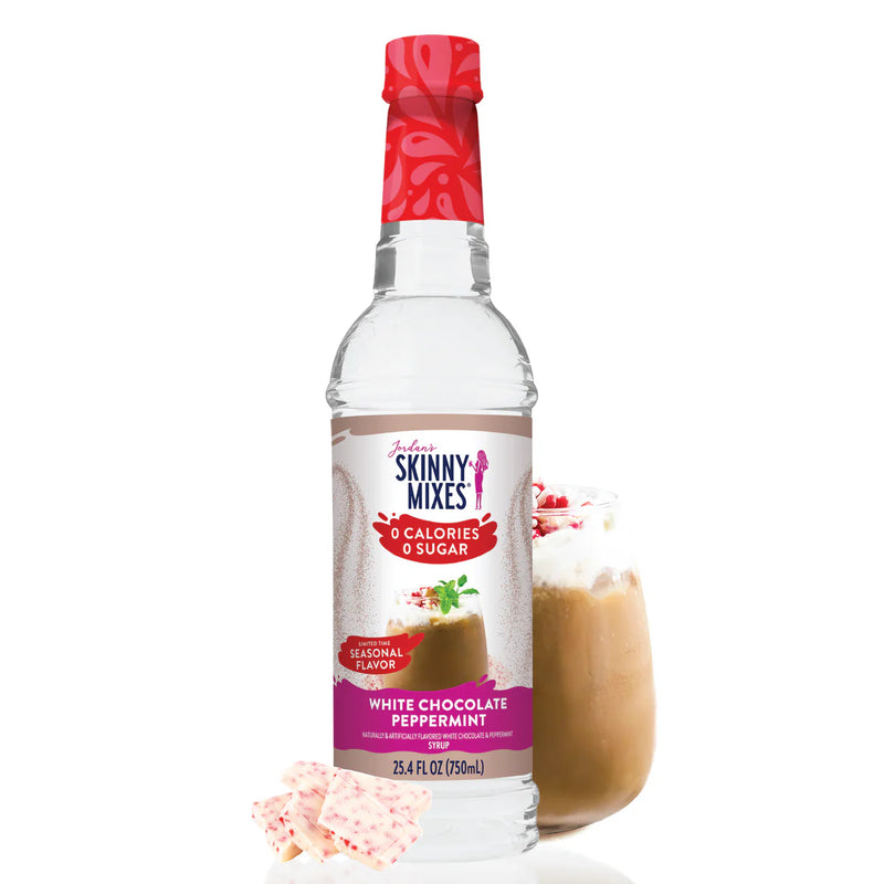 Skinny Mixes White Chocolate Peppermint syrup bottle with a glass of a peppermint mocha drink.