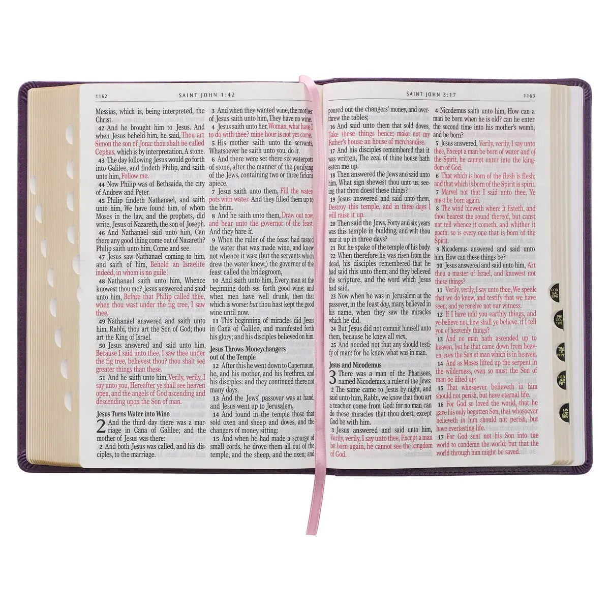 Open book with text and a pink ribbon marker on a white background