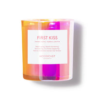 Colorful candle labeled 'First Kiss' by Moodcast on a white background