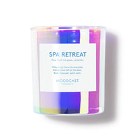 Candle with a colorful iridescent finish and 'SPA RETREAT' label on a white background