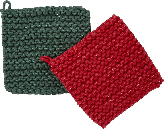 Two square chunky-knit potholders in dark green and red, overlapping on a plain white background.
