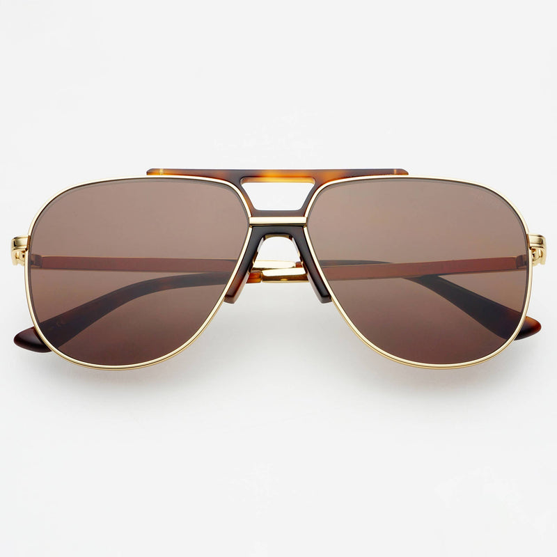 Aviator sunglasses with gold frame and brown lenses on a white background