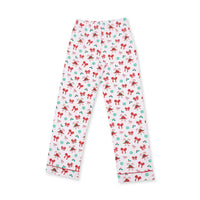 White adult pajama pants with an all-over Christmas print of red bows, green ornaments, and holly, finished with red piping along the cuffs.