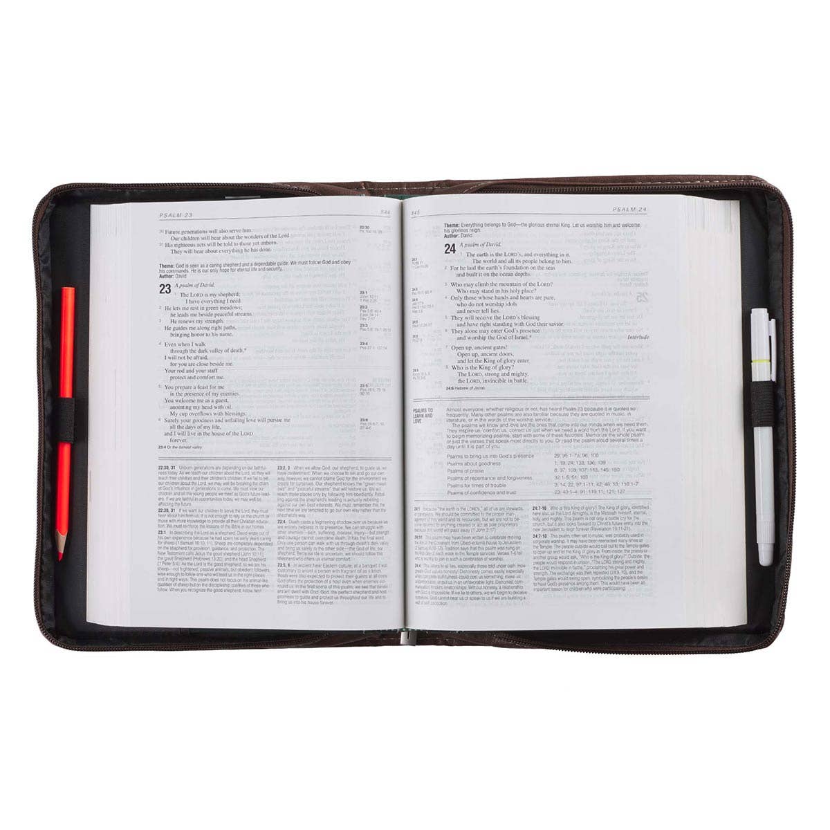 Open book in a black leather cover with pen slots on a white background