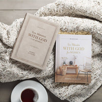 Two books titled 'Ten Minutes with God for Women' by Debbie Alsdorf on a textured blanket with a cup of coffee.
