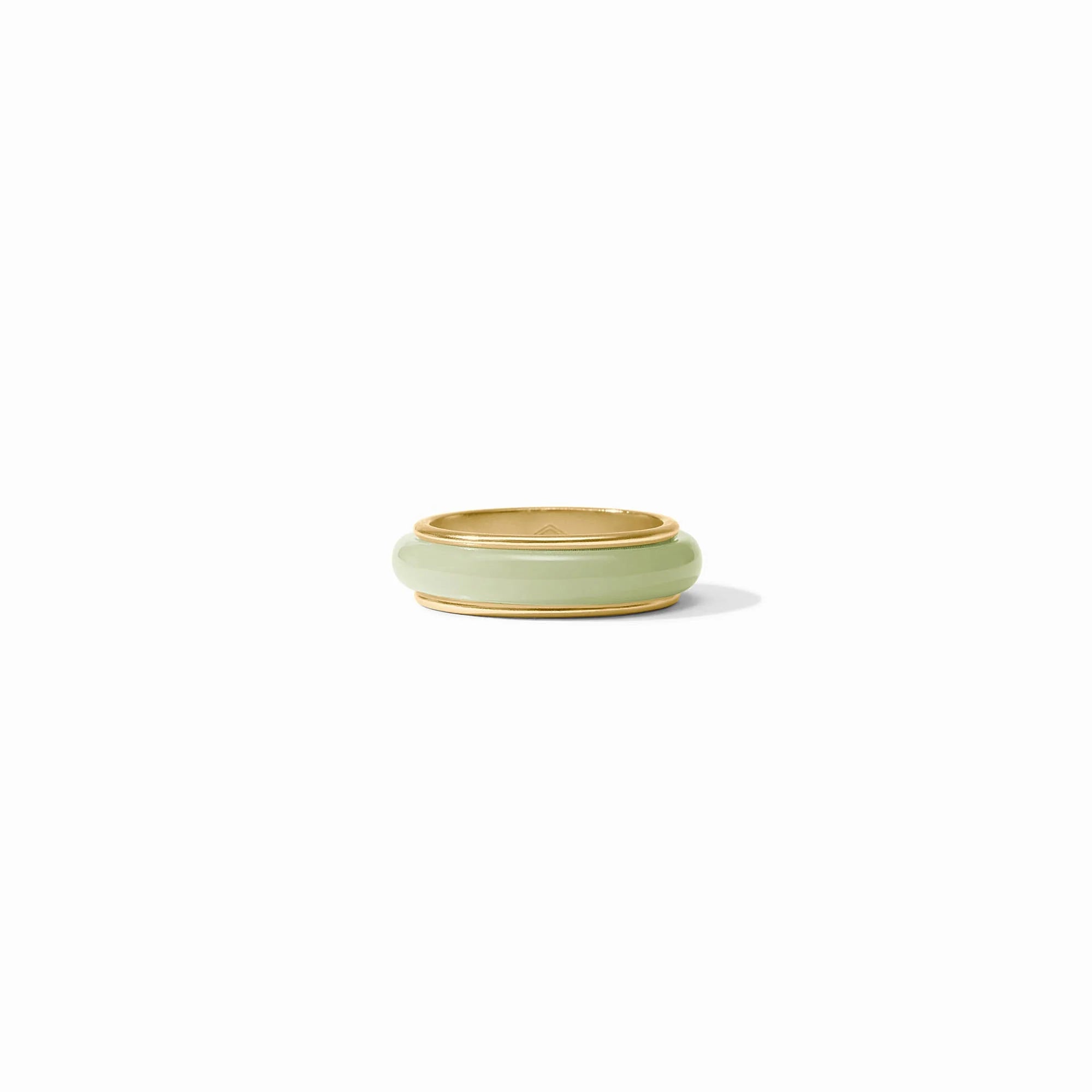 Green ceramic ring dish on a white background