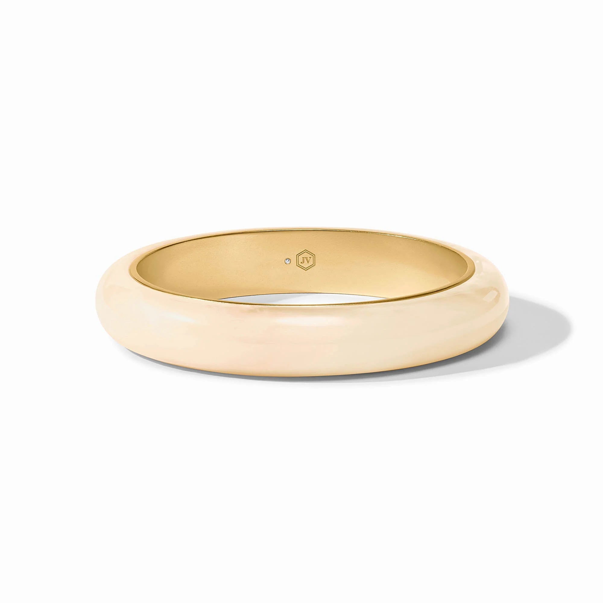 Gold ring with 'JW' logo on a white background
