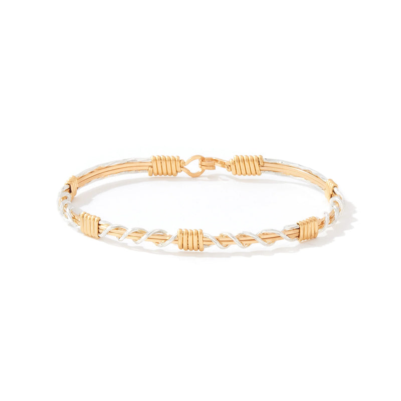 Gold bracelet on a white background