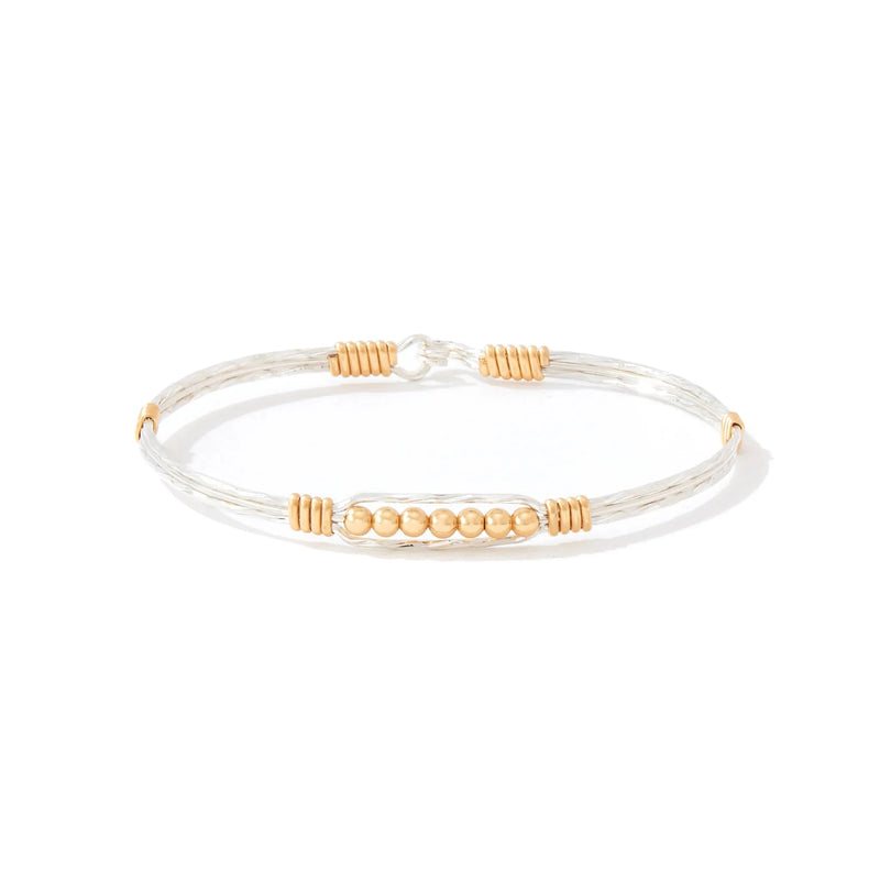 Bracelet with gold accents on a white background