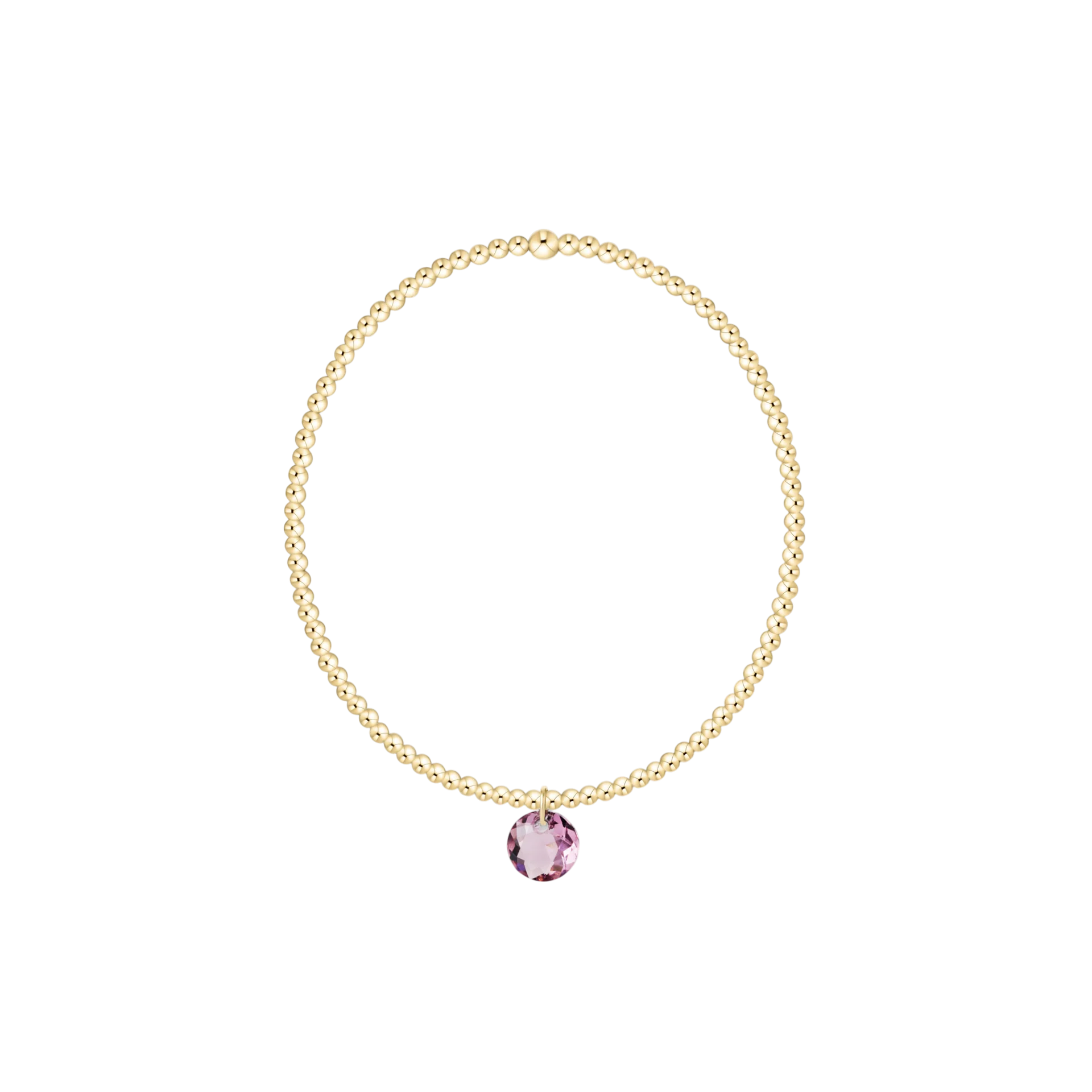 Gold necklace with a pink gemstone on a white background