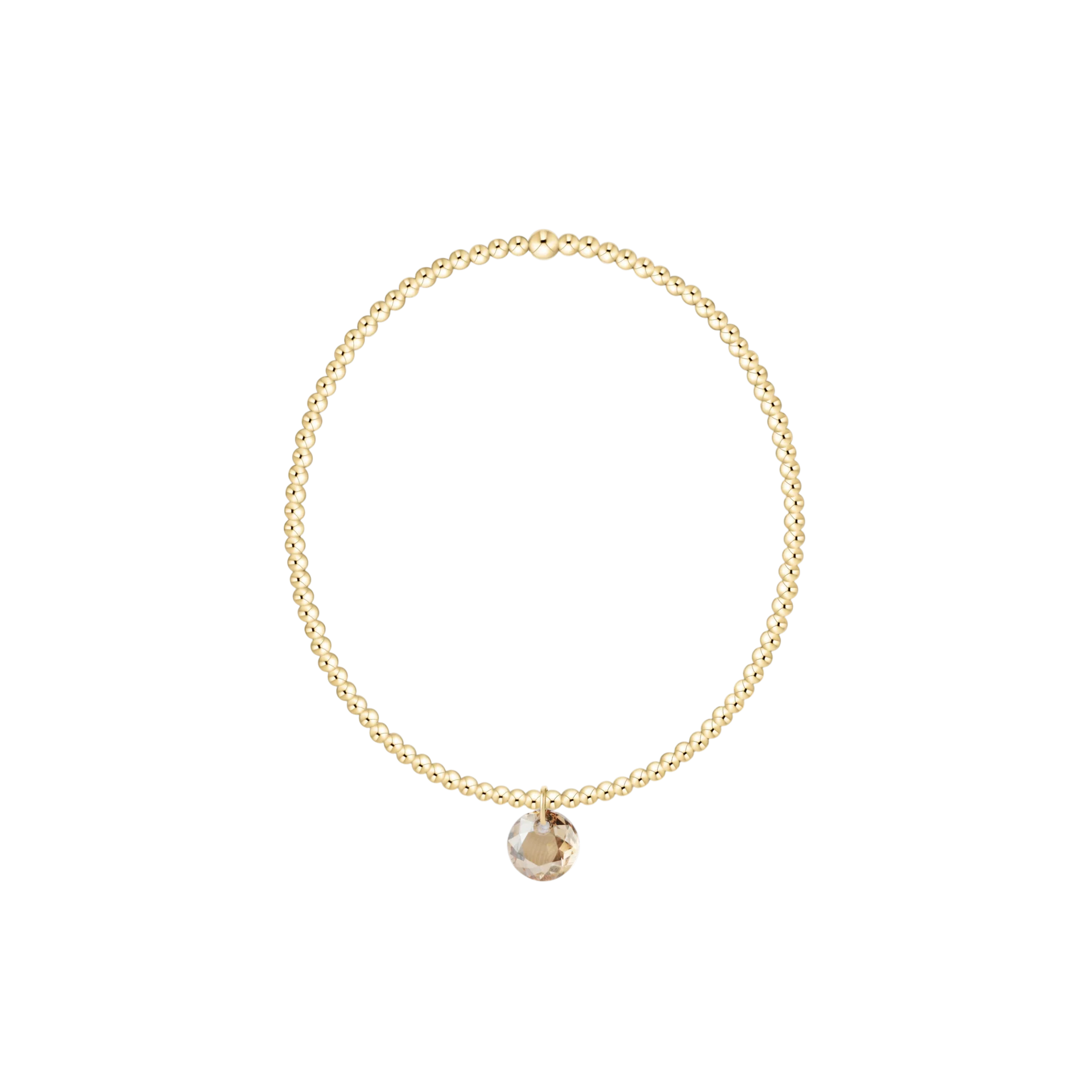 Gold bracelet with a small round pendant on a white background