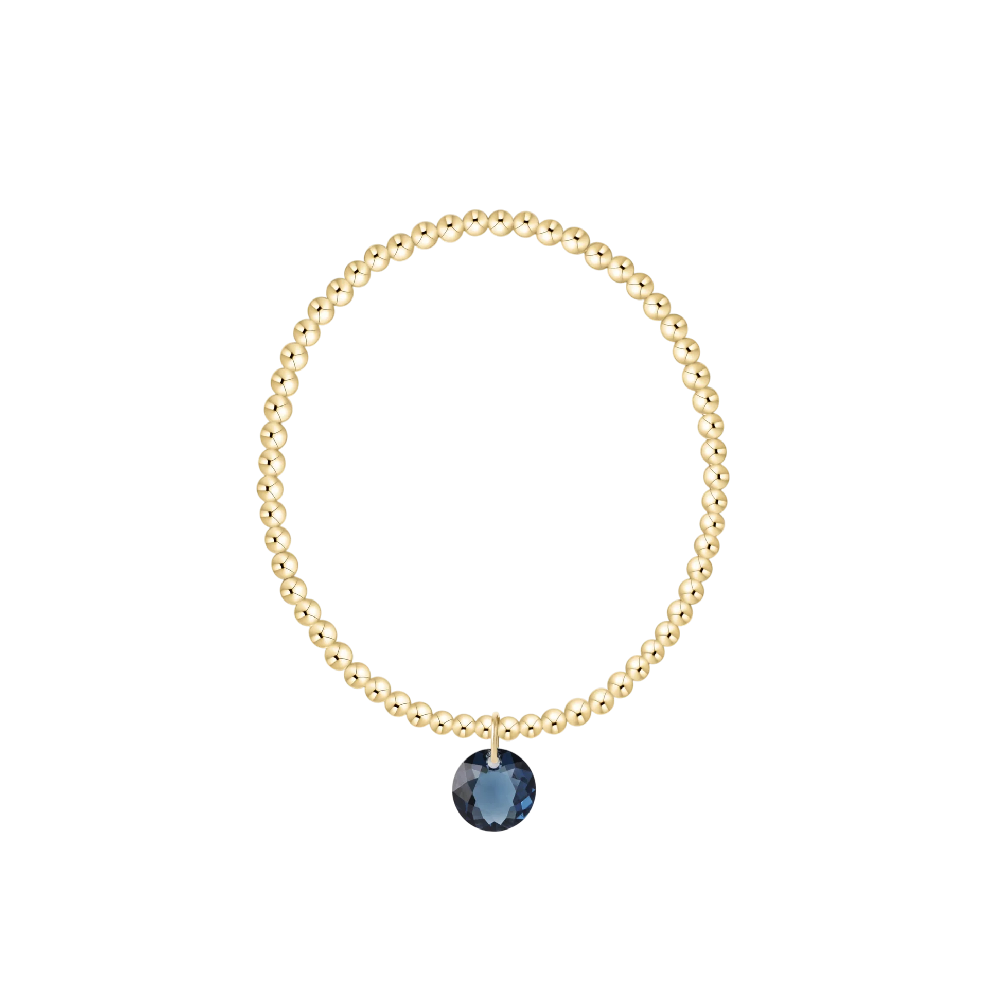 Gold beaded bracelet with blue charm