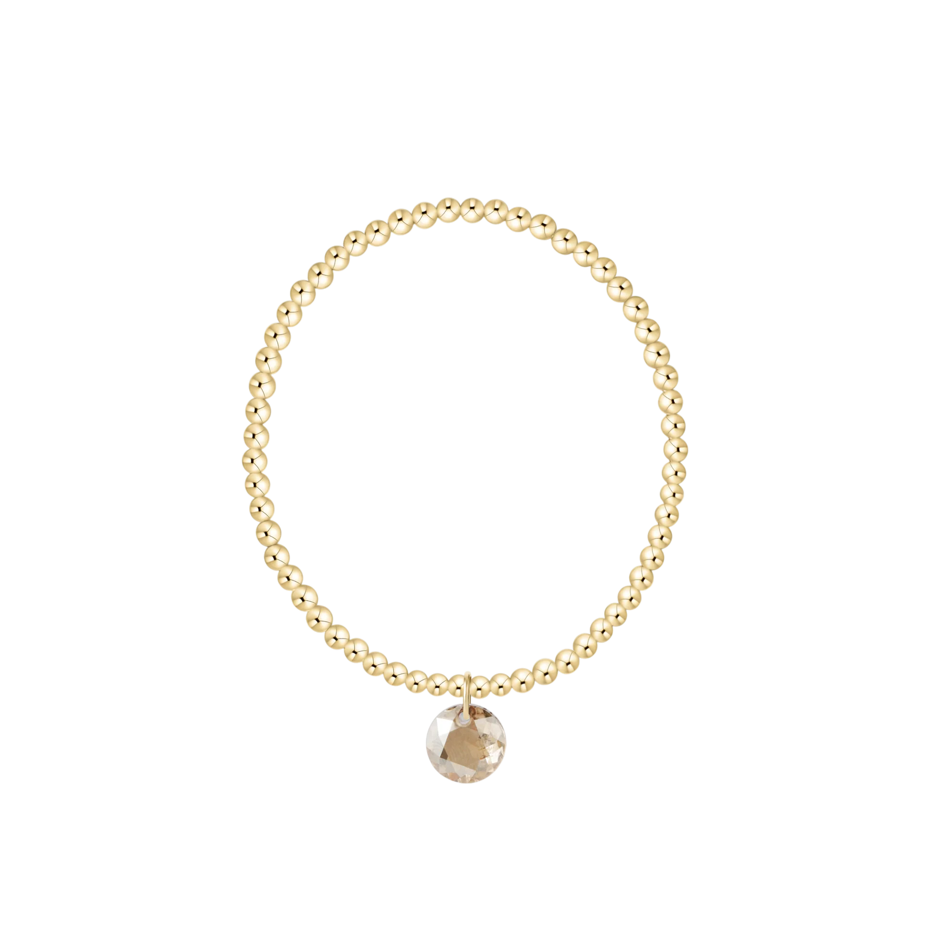 Gold beaded bracelet with a round pendant on a white background