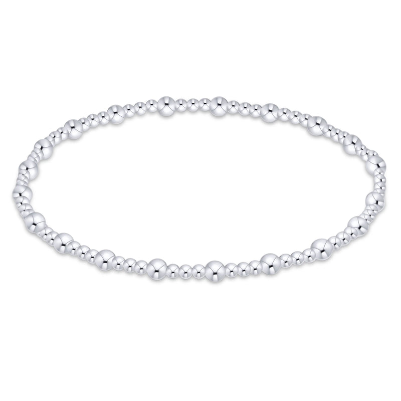 A silver beaded stretch bracelet with alternating polished and matte metallic beads, shown on a plain white background.