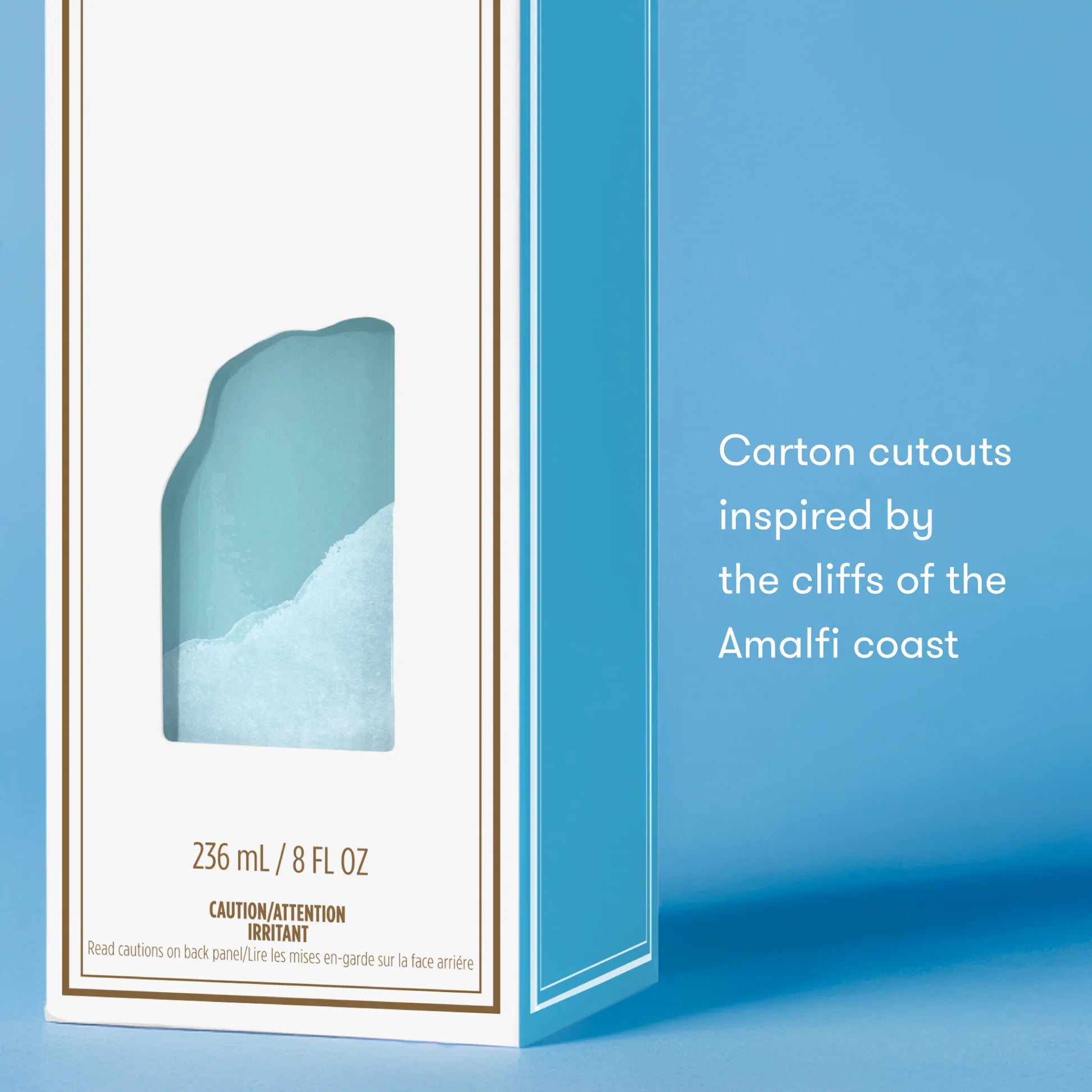 Product packaging with a blue design inspired by the Amalfi coast on a light blue background.