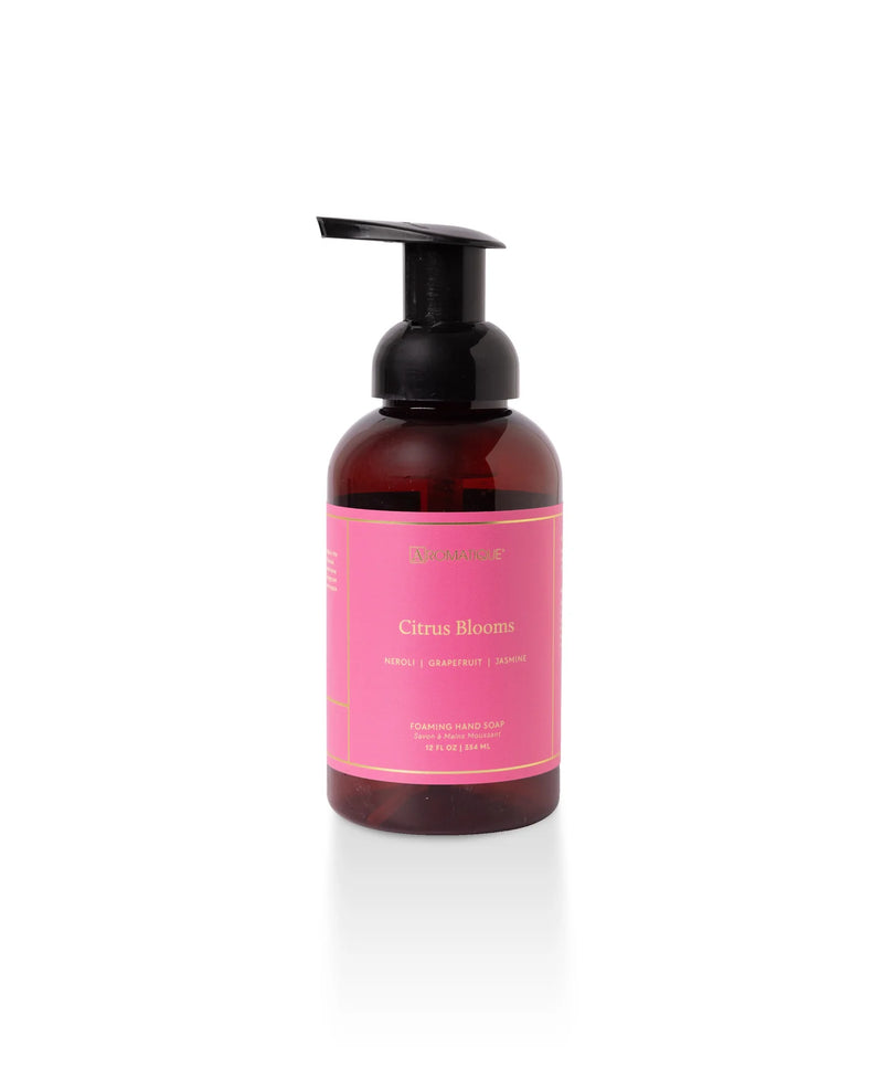 Hand soap bottle with pink label on a white background