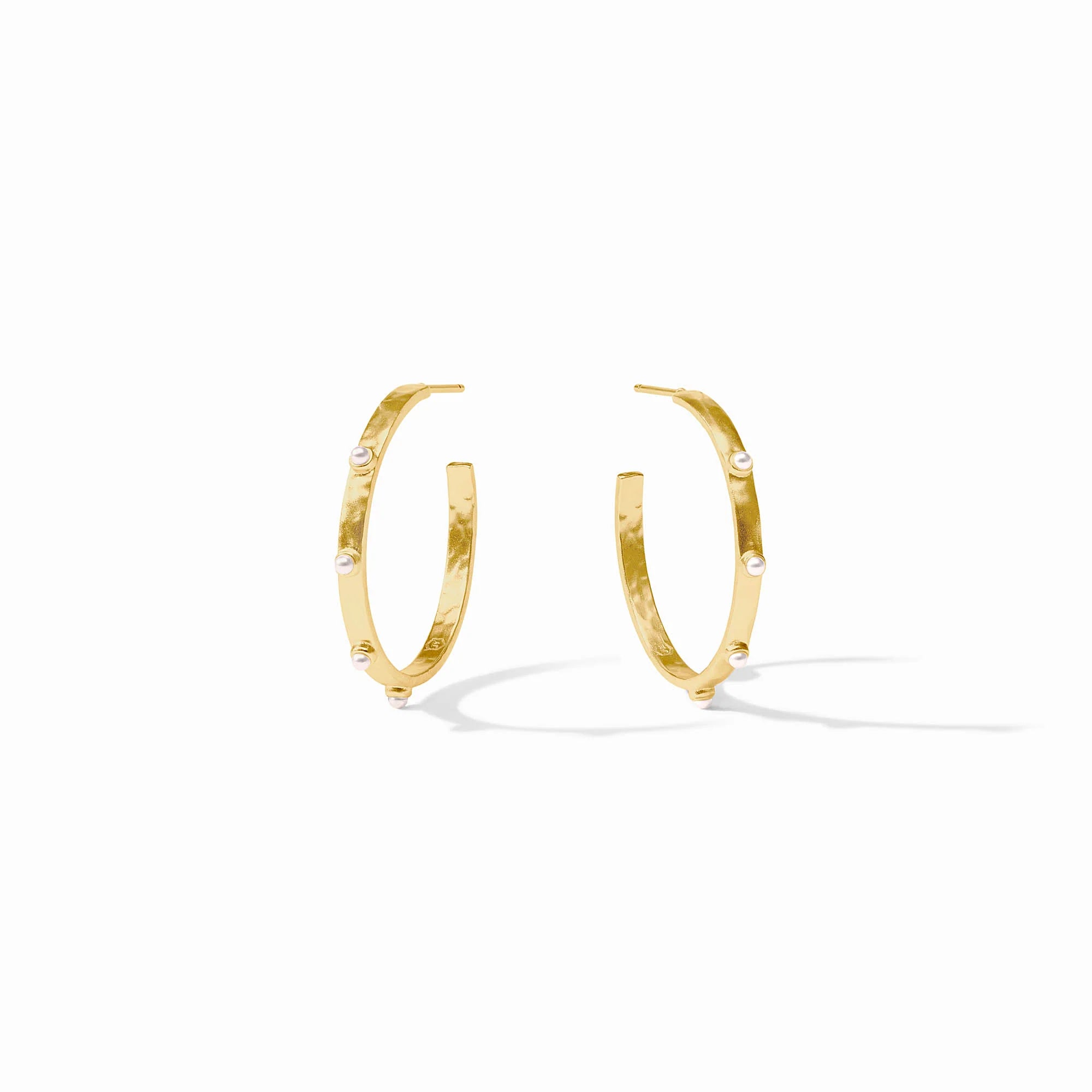 Gold hoop earrings on a white background