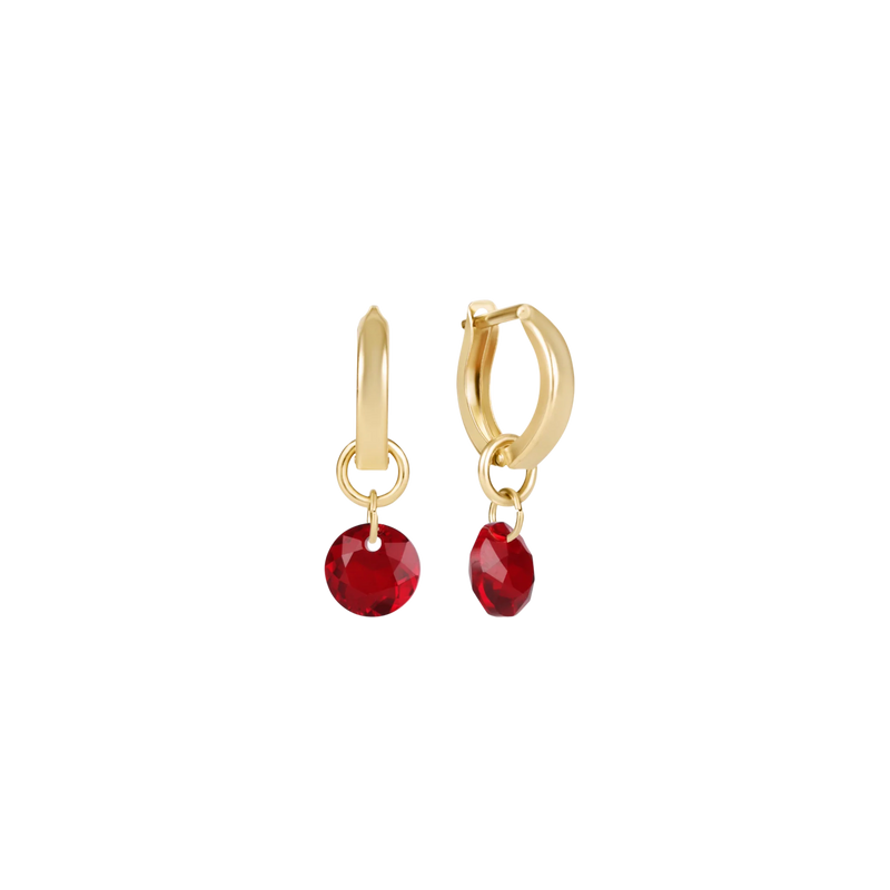 Gold hoop earrings with red gemstone