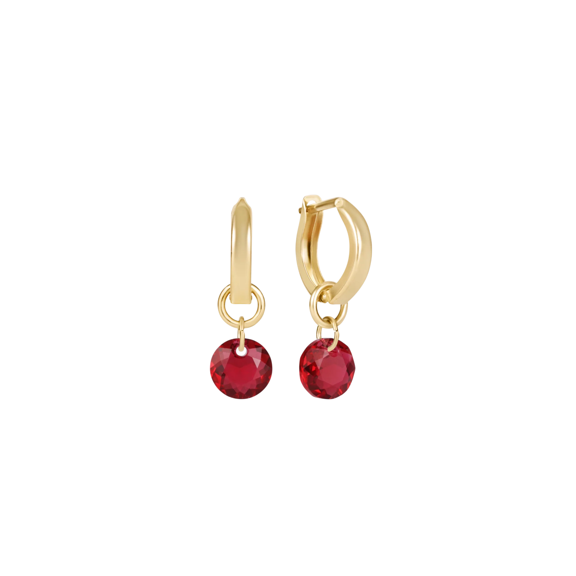 Gold hoop earrings with red gemstones on a white background