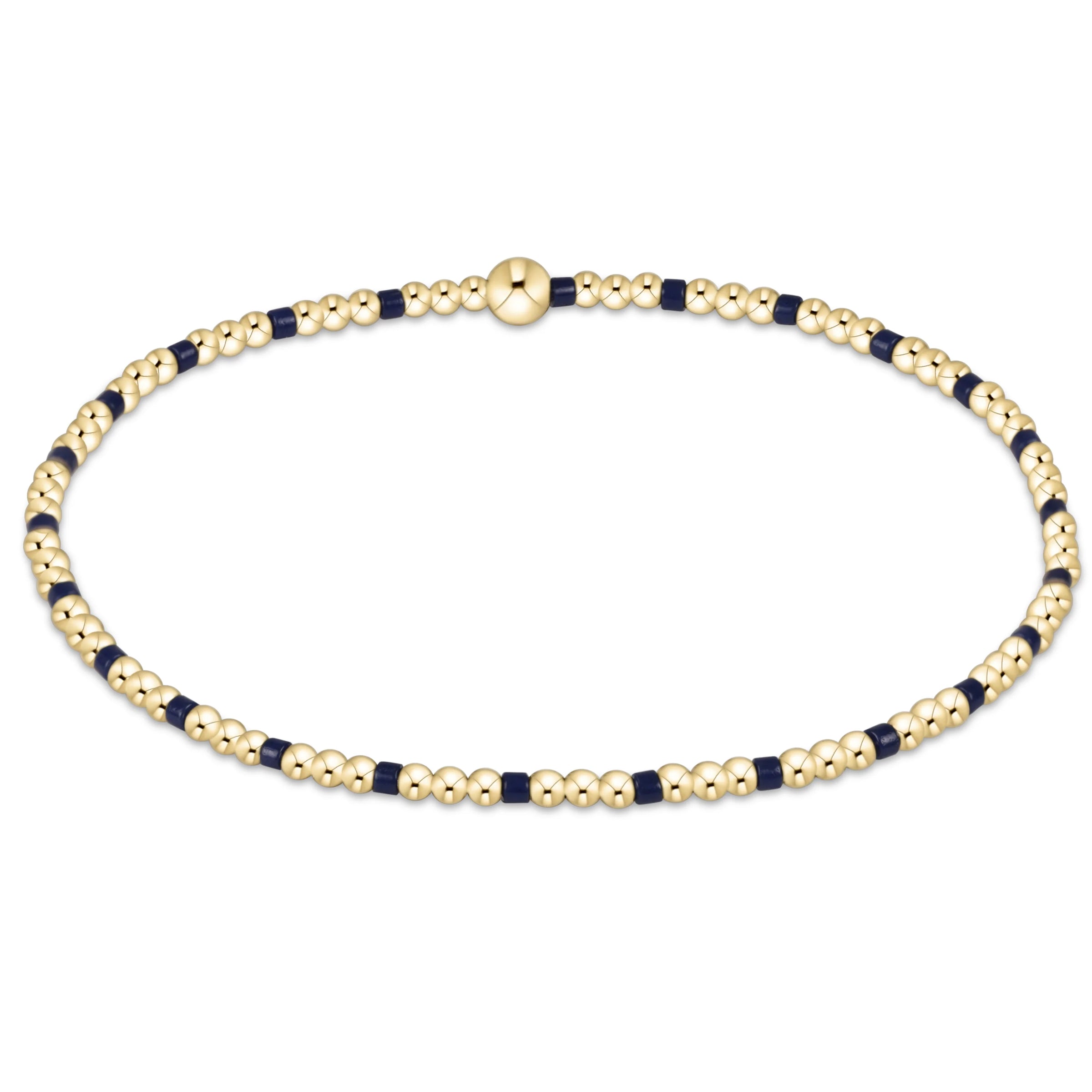 Gold beaded bracelet with alternating navy 2mm beads on a white background
