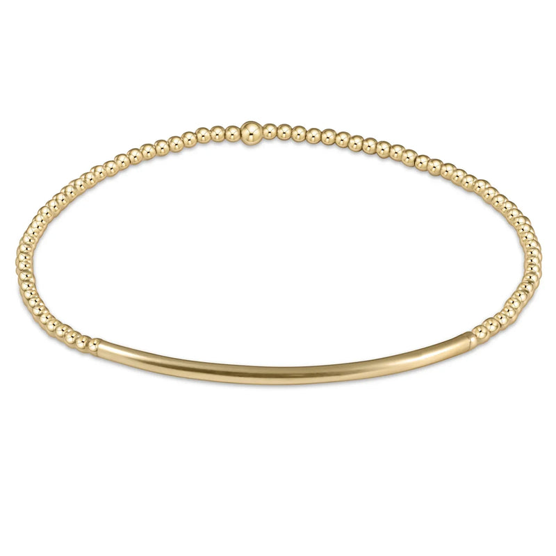 Gold beaded bracelet with gold bar accent.